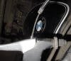 The clutch cable is ready to be dropped down and out of the clutch lever. In the background is a Hoske tank and emblem.
