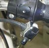 This shows the holes drilled into the throttle casting to mount the adapter for the BMW turn signal switch.