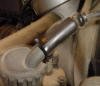 This shows the rubber boot that covers the throttle cable at the Bing carb to keep water out.