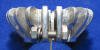 This is a side view photo of the commonly used finned exhaust nut that could be bolted on the plain exhaust nut ring of the R50 and R60 BMW motorcycle.  This made it look like a sport model finned nut