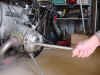 Ed Korn's BMW motorcycle exhaust nut tool in operation.