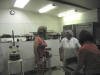 Diane is giving some baking tips to the Spaan's cookie bakers.